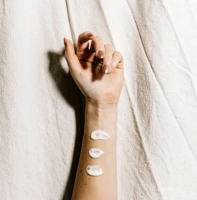 person with black and white hearts tattoo on right hand